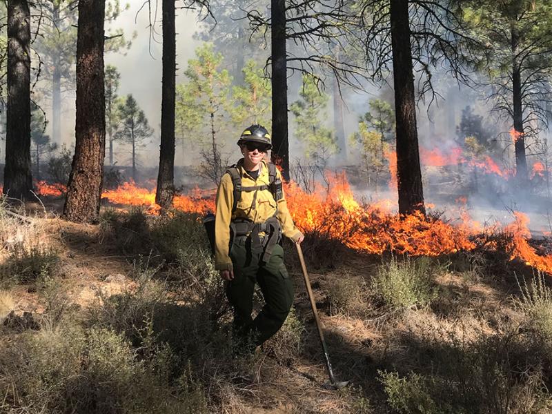 Katie Sauerbrey of The Nature Conservancy monitors a controlled burn.
