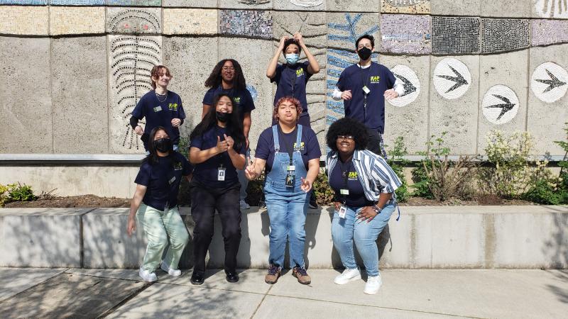 Group of ZAP youths outside in front of a mural