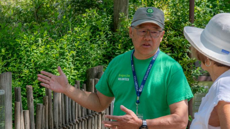 Volunteer talking to visitor