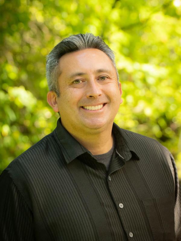 Headshot of Tom Rogers. 