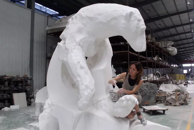 Veronica Dam de Nogales works on the Melting Ice Bear sculpture.