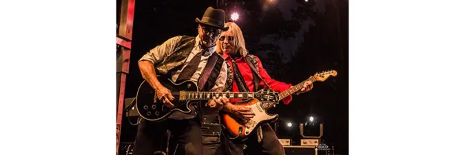Petty Fever band members playing guitar