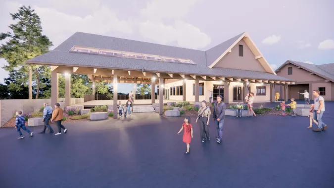 An image of cascade crest building with a newly designed shelter over a public gathering area.