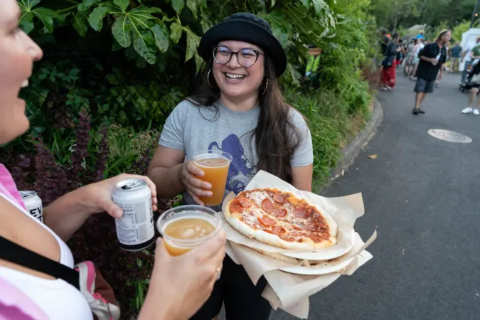 Zoo guests enjoy pizza and beer.