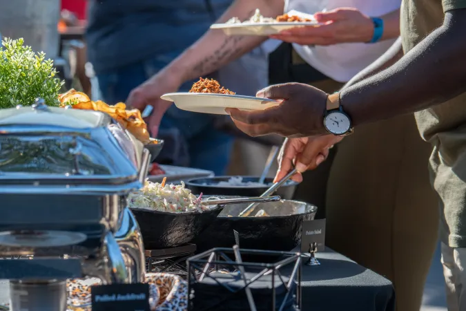 People serving themselves from a buffet