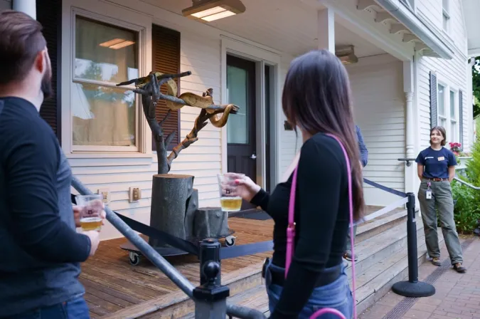 couple viewing snake up close at animal encounter